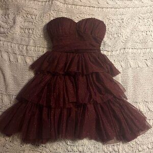 Dark purple strapless sparkly dress with with a...